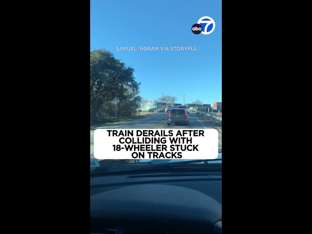 Train derails after colliding with 18-wheeler stuck on tracks