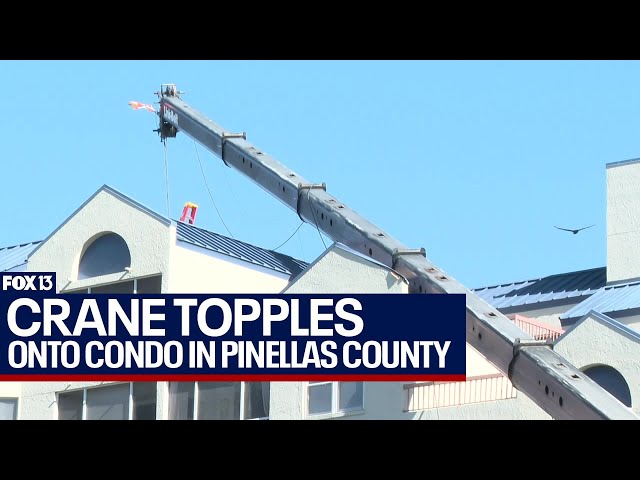 Construction crane tips onto condo building in Pinellas County