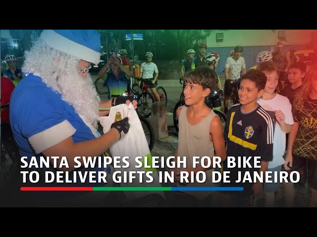 Santa swipes sleigh for bike to deliver gifts in Rio de Janeiro | ABS-CBN News