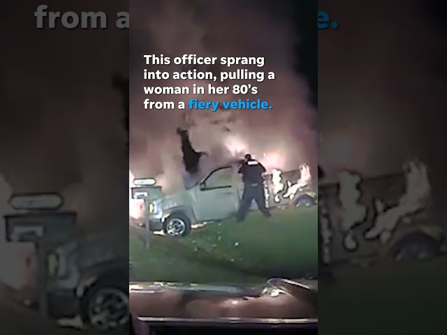 Watch this heroic officer save a woman from a burning vehicle #Shorts