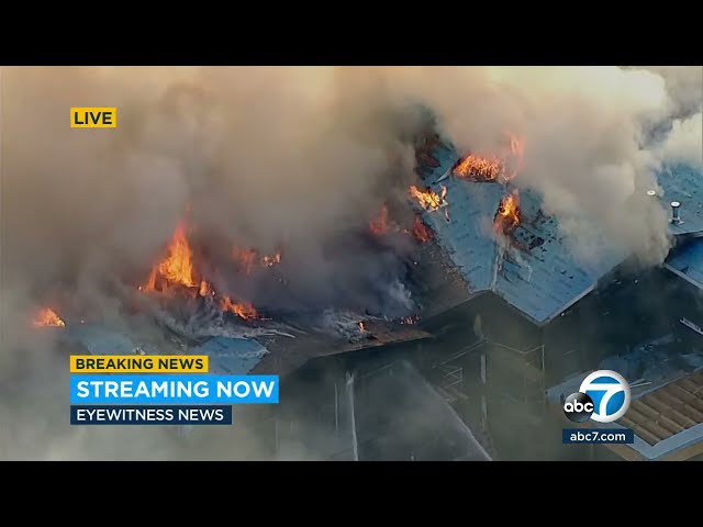 Flames tear through large three-story Encino home under construction