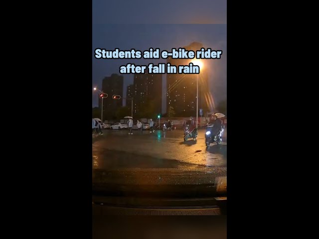 Students aid e-bike rider after fall in rain