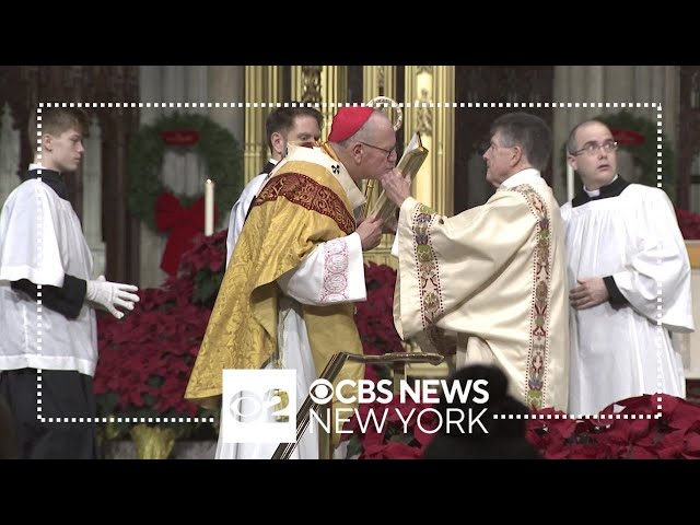 Visitors in awe of St. Patrick's Cathedral on Christmas