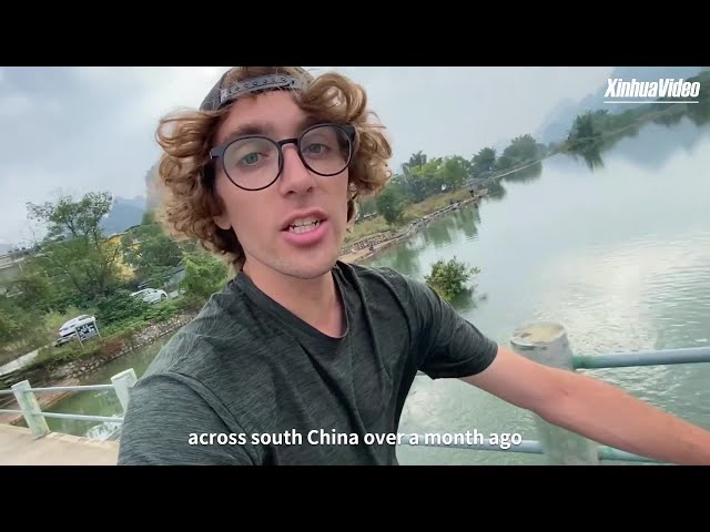 GLOBALink | American cyclist smells the "roses" during a bike trip across south China