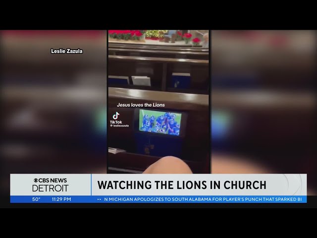 Detroit Lions fans caught sneaking a peek at the game during Christmas Eve mass