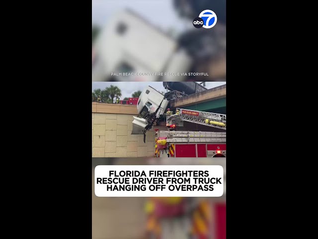 Florida firefighters rescue driver from truck hanging off overpass