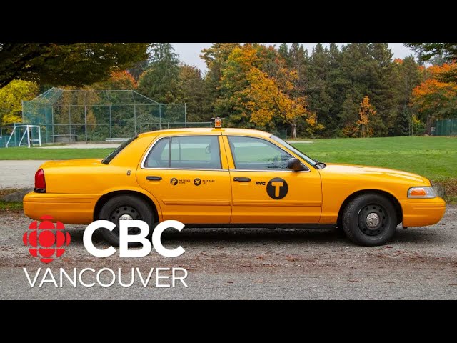 Local car enthusiast driving around downtown Vancouver in New York City cab