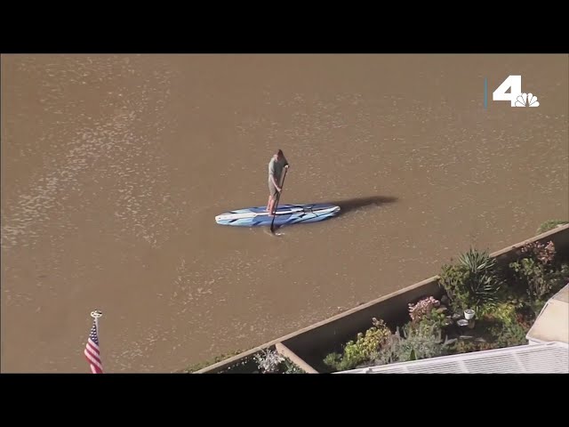 Paddleboarder navigates flooded Oxnard streets