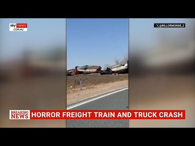 Two dead after crash between freight train and truck