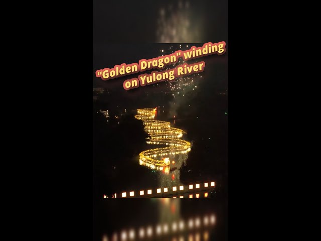 "Golden dragon" winding on river to welcome in new year