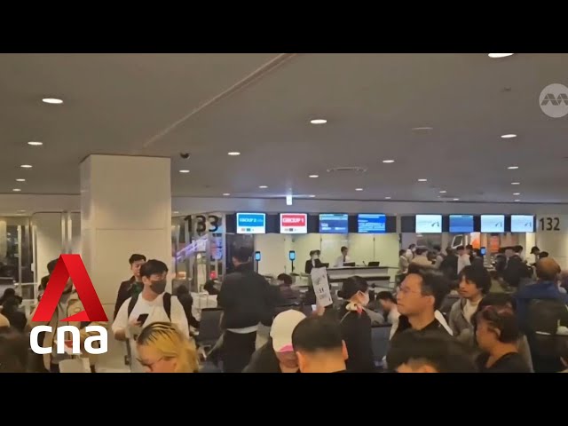 All runways at Tokyo's Haneda airport closed after Japan Airlines plane catches fire