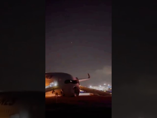 Passengers evacuate burning plane