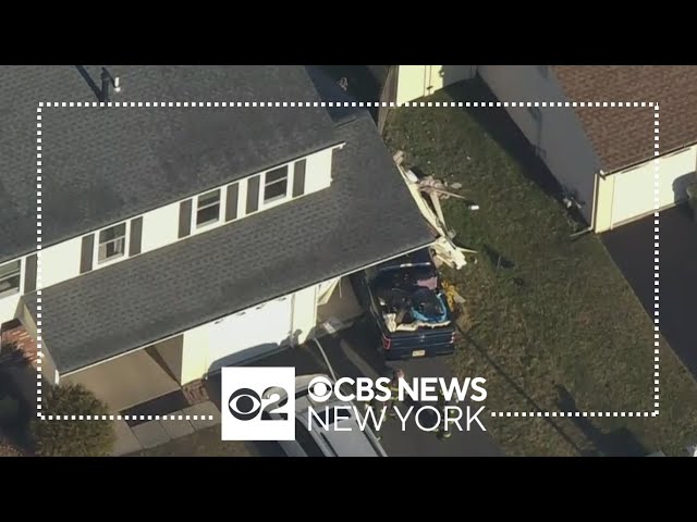 Car slams into home in Howell Township, New Jersey