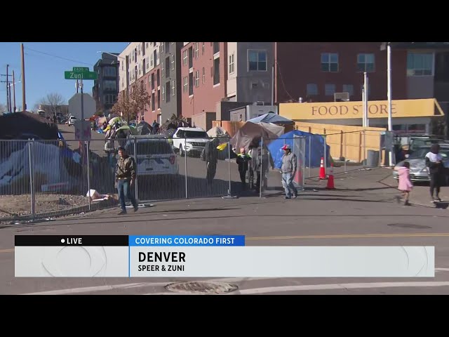 Tent ignites during migrant camp relocation in Denver