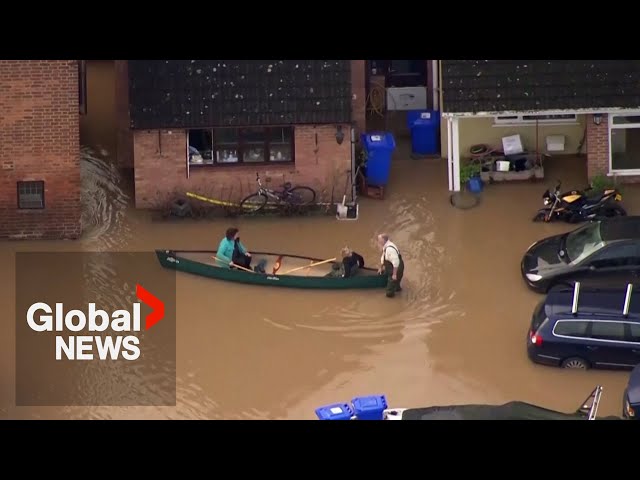 UK floods: Locals paddle through streets in southwest England