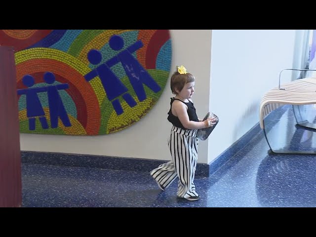 Michigan 2-year-old rings bell after beating cancer