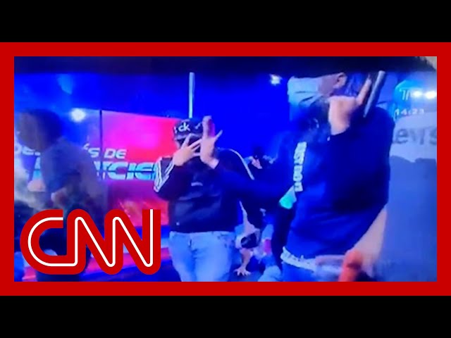 Hooded men take over live TV broadcast in Ecuador