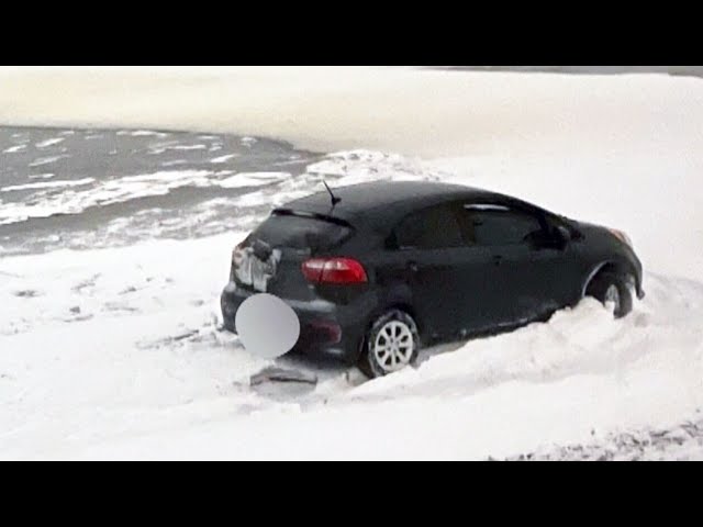 Ottawa driver saved from vehicle after driving onto ice in winter storm