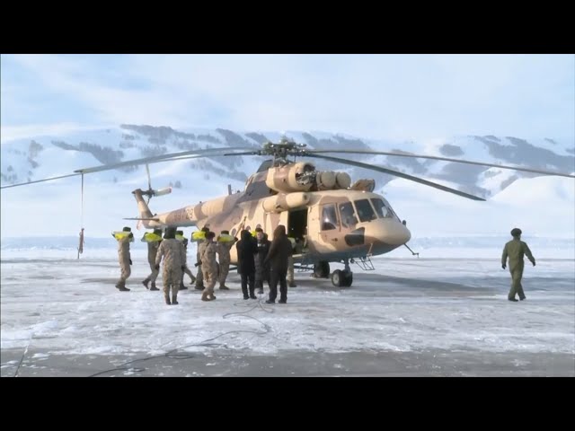 Helicopters deliver supplies after avalanches in Xinjiang's Kanas