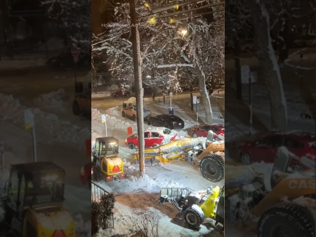 Montreal snow plow pushes car stuck in snow bank