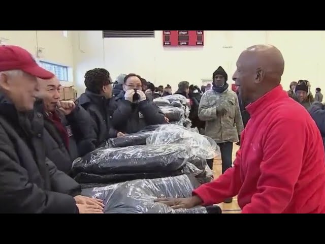 Jesse White helps hand out over 500 winter coats to those in need