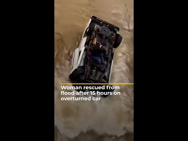 Woman rescued from flood after 15 hours on overturned car