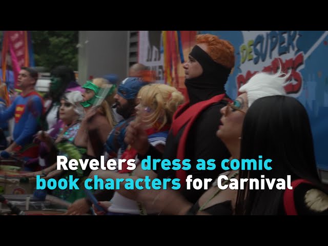 Revelers dress as comic book characters for Carnival