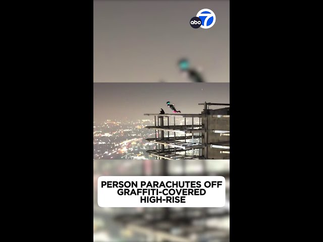 Person parachutes off graffiti-covered high-rise in DTLA