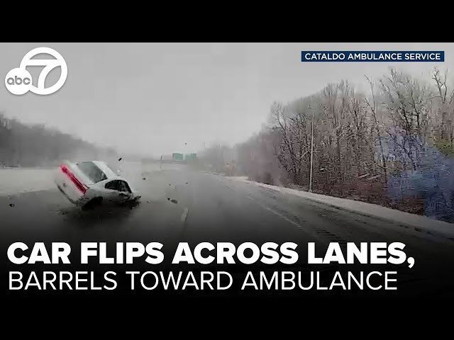 Dashcam video shows car flip across lanes, barrel toward ambulance