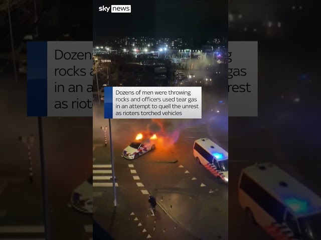 The Hague: Police car torched during riot