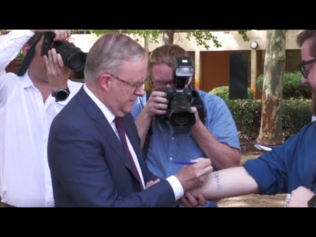 ‘Get it tattooed on’: Prime Minister signs GST promise on journalist’s arm