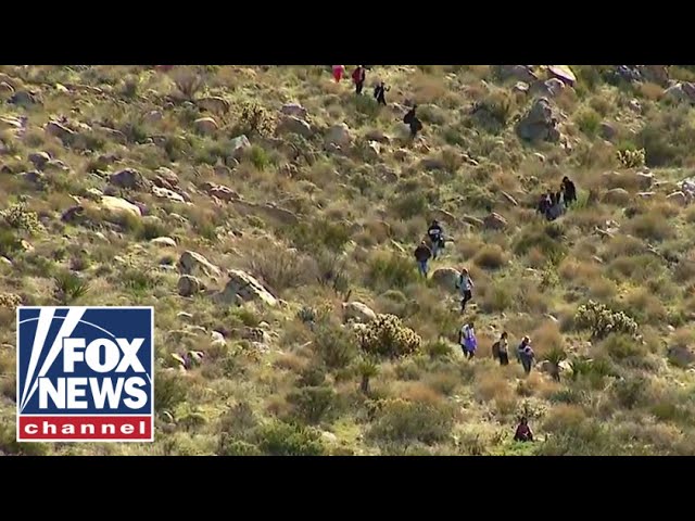 Migrants scale mountain like 'trail' of ants to get into US