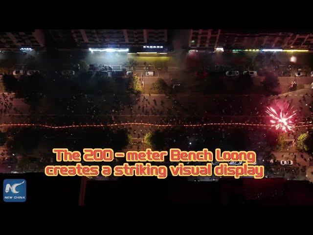 Village in east China celebrates Chinese New Year with 200m bench lantern