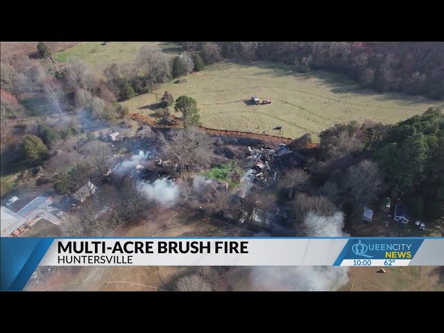 Huntersville brush fire threatens homes, horses