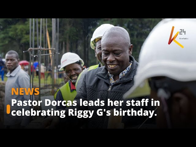 Pastor Dorcas leads her staff in celebrating Riggy G's birthday.