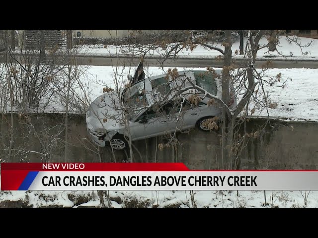 Car crashes, dangles above Cherry Creek trail