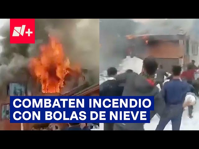 Hombres intentan detener incendio de hotel con bolas de nieve - N+