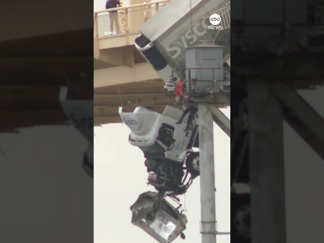 Semi truck dangles off edge of a Kentucky bridge