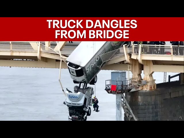 Louisville driver rescued from semi-truck hanging over Ohio River