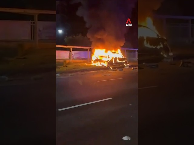 Burning car, damaged school bus at scene of accident along Bukit Timah Road