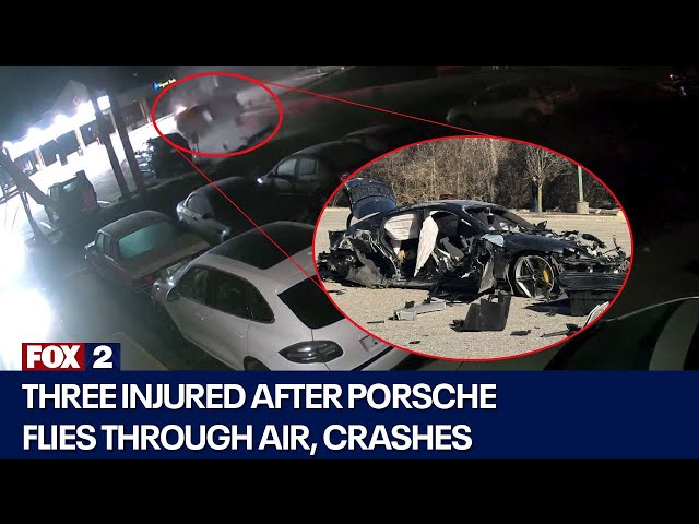 ⁣Three injured after Porsche flies through air, crashes