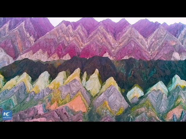 Striking display of colorful rocks adorn mountain in Xinjiang