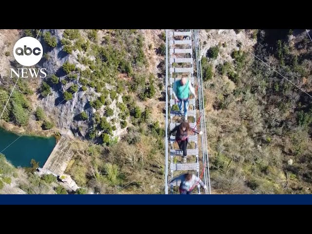 'Tibetan'-style bridge suspended more than 570 feet above the ground connects two Italian 