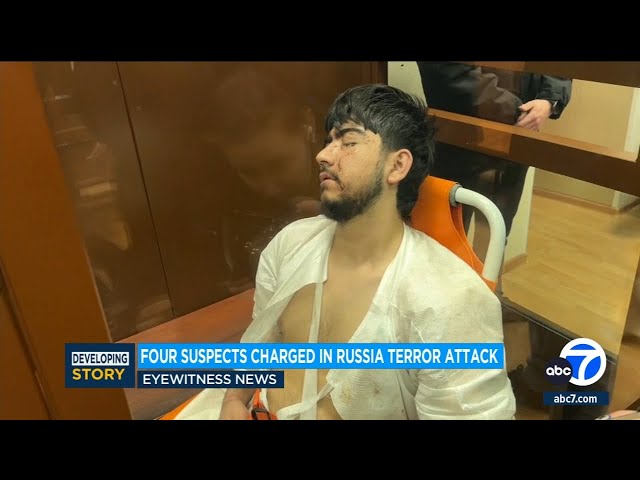 4 men charged in Moscow attack, showing signs of beatings at hearing as court says 2 accept guilt