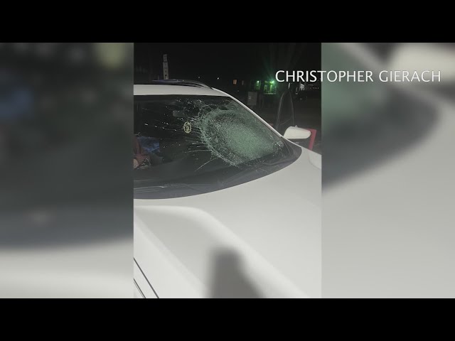 Couple says someone in passing car threw object at them, shattering windshield