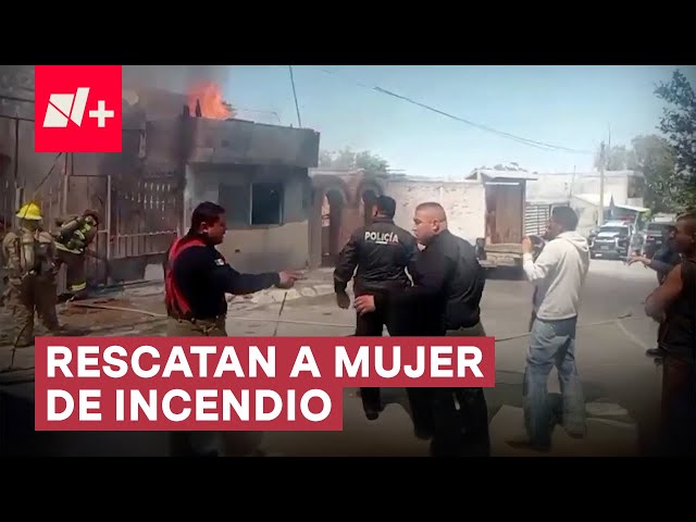 ⁣Policías rescatan a mujer de las llamas en el incendio de su casa - N+