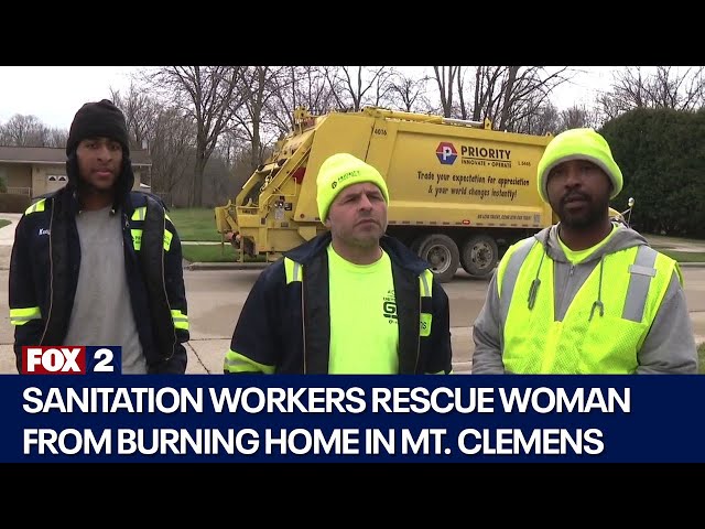 WATCH: Sanitation workers rescue woman from burning home