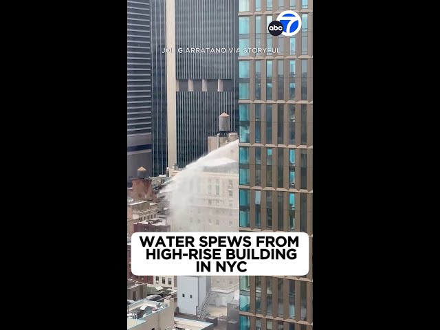 Water spews from high-rise building in NYC