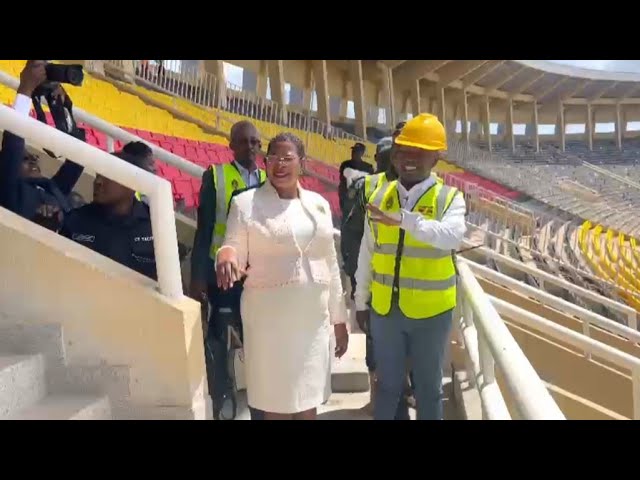 NAMBOOLE STADIUM STATE: ANITA AMONG INSPECTS WORKS IN GUIDANCE OF UPDF ENGINEER PETER KIDEMUKA.