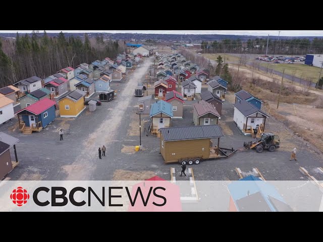 Tiny home village complete after ‘cranking out’ a house a week for 2 years